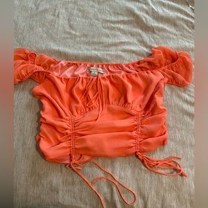 Pink top with adjustable cinches